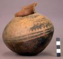 Ceramic, complete jar, round bottom, blk on buff, neck broken, mended