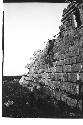 Boy before stairway to third story at Monjas, looking east