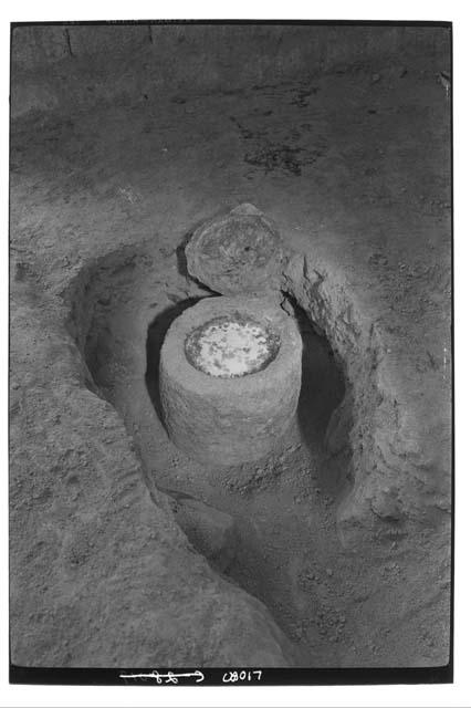 Turquoise mosaic plaque in limestone urn, as first uncoverd Mar. 6, 1928.