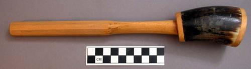 Rattle, basswood and cowhorn. 30 x 5.5 cm. (length x diameter). traditionally