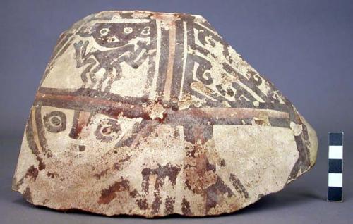 Ceramic rim and body sherds from jar, red on white, anthropomorphic dec.