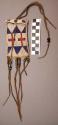 Blackfoot Strike-A-Light pouch. Commercially tanned leather; beadwork & fringe