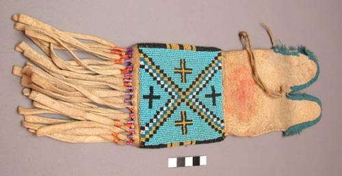 Skin bag with notched top & fringe; top edges bound with beads