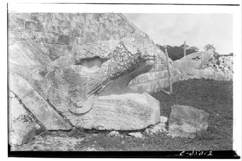 Serpent Balustrades. Head from stairway leading to Castillo