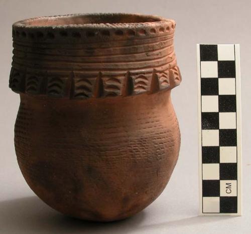 Jar with wide sculpted band at rim