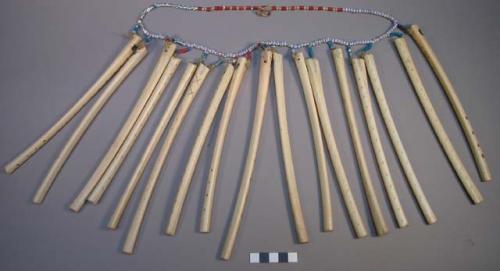 Necklace of bead and bone dance flutes