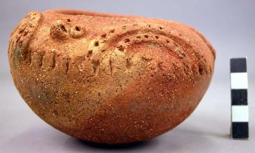 Pottery bowl with round base - incised applique decoration