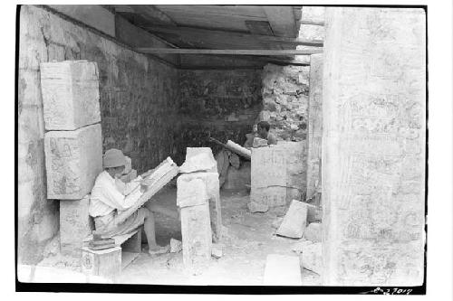 T.of War. Artists at work in outer chamber of buried temple copying mural painti