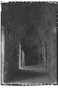 Boy in the doorway of an interior chamber at Monjas