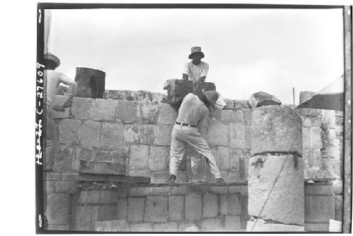 Placing sapote blocks at arches at the Temple of Wall Panels