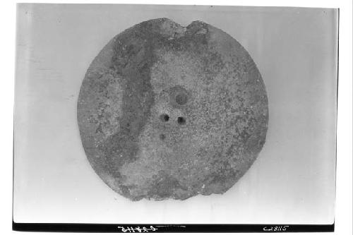 NW Colonnade, sandstone disk found under altar of NW Col. - reverse.