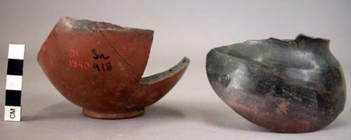 Potsherd, redish, one is a long spout