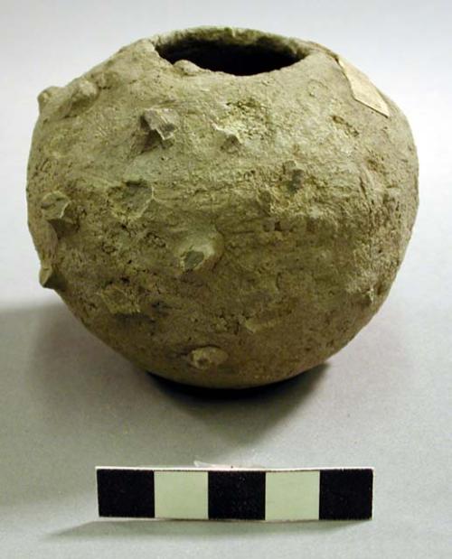 One small round vessel with small stone insets