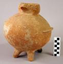 4 leg turkey effigy vessel with traces of white paint.  Sandy gritty red clay.
