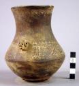 Maroon incised ware effigy jar