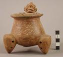 Orange-Brown Ware tripod vessel with rattle legs, articulated head