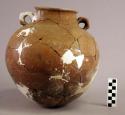 Restored incised red pottery jar