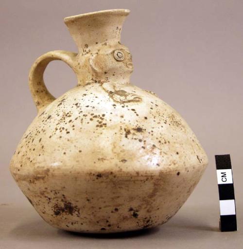 Pottery jar, handle on side, white clay, human face