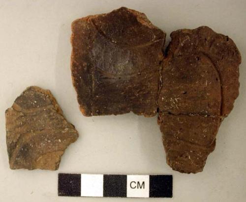 Ceramic, earthenware body sherds, incised, two are mended to a sherd labeled 34433.2