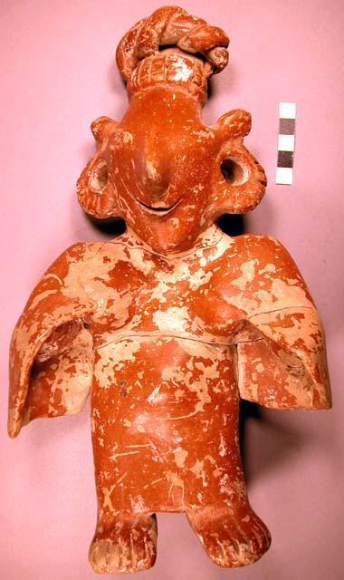 Terra cotta human figure, covered with red slip