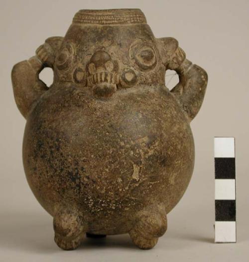 Small pottery effigy jar - incised