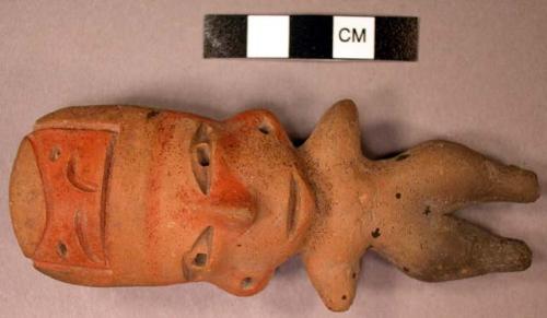 Pottery human figurine-Tlatilco style with glyph on forehead. Orange buff clay,