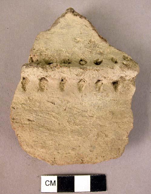 Coarse grey potsherd decorated with punch-marked applique ridge