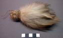 Bundle of white feathers, tied together with string