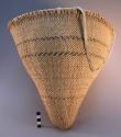 Small conical basket for gathering seeds; used with seed beater.