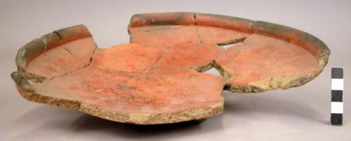 4 sherds, 1 restored, of shallow pottery vessel