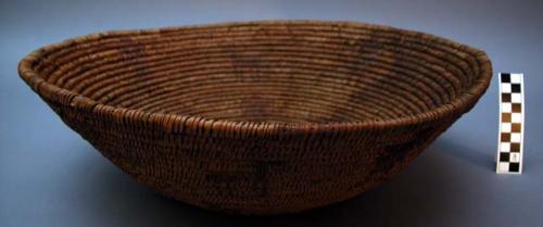 Basket. 3 rod coiled.Bowl shaped w/ human and animal