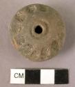 Pottery spindle whorl with stamped designs