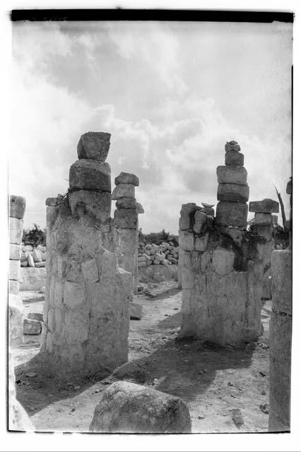 N. Colonnade. Square masonry pillars surrounding round columns which had begun t