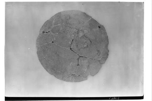 T. of Warriors, sandstone disk found under corner.