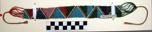 Beadwork armlet (?)--red, green, yellow, blue and white