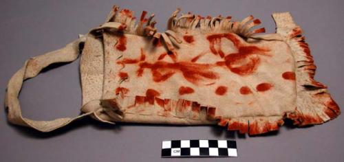 Fringed buckskin bag with painted designs of dots (stars) and figure of a girl dancing.