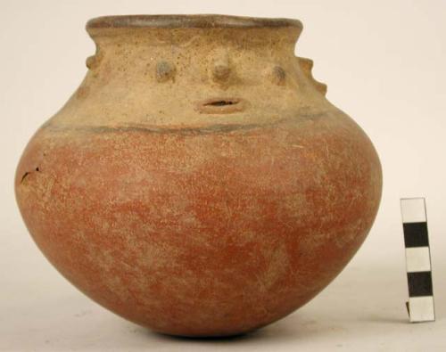 Pottery vessel - spherical base, stylized face on one side