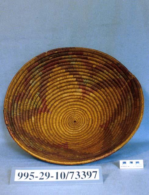 Large coiled bowl with flower motif