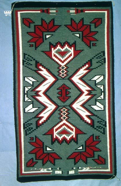 Klagetoh rug with two rainbow Yei figures