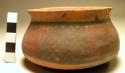 Ceramic bowl, 2 lug handles, molded, polychrome exterior, chipped rim