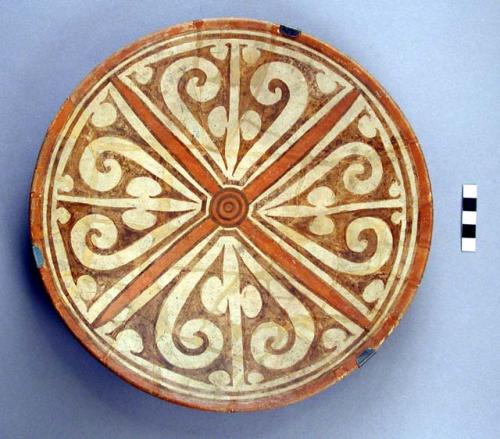 Fragmentary plate, white slip, red & brown decor.