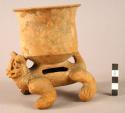 Pottery jar supported by jaguar effigy - light brown, probably faded from red.