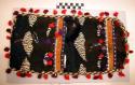 Loon skin pouch with feather motif decorated with beads and woolen balls