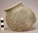 Ceramic bowl rim sherd, side wall, black ware, pitted surface