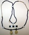 Woman's necklace of blue, white, and brass beads and 2 shell pendants.
