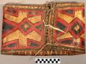 Small parfleche case of rawhide. Designs painted in red, dark dull blue, dull green.