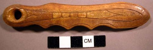 Ivory implement with finger grips