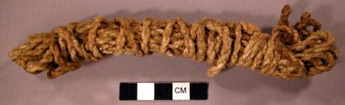 Piece of rope coiled--part of contents of skin bag, 10-6228