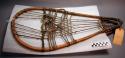 Pair of snow shoes, round-tail type. Mountain maple wood and horse hide thong net