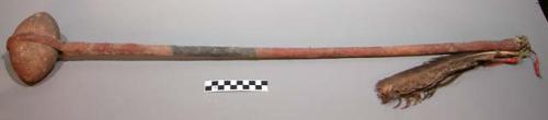 Plains fixed stone headed club. Long wood handle covered w/ hide. Ovoid head.